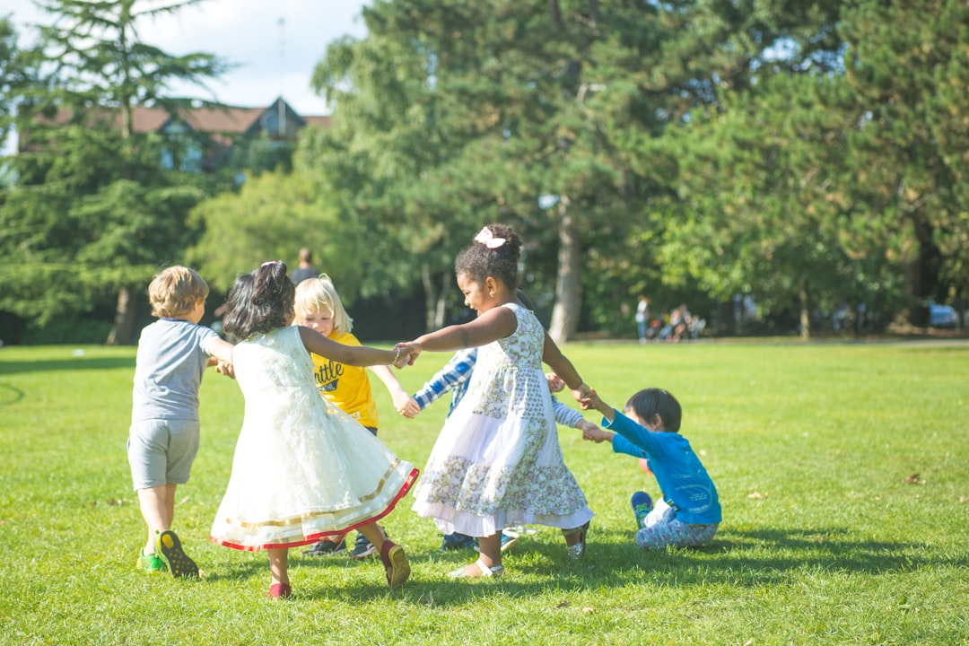 children running through a green Royal Park in London, enjoying free outdoor activities for London kids during the summer.