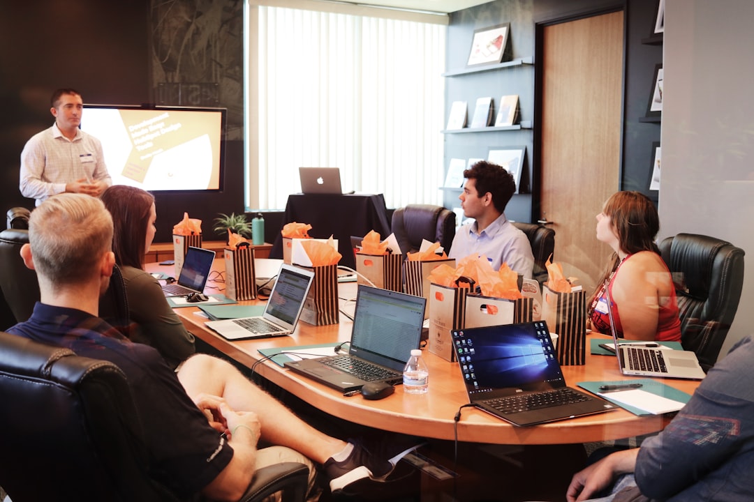 A first-time founder presenting his startup pitch to a venture capital investor in a London office