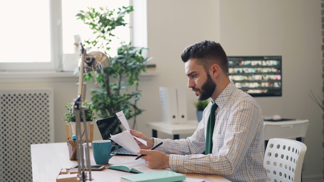 A first-time founder signs incorporation documents during the limited company registration process in London
