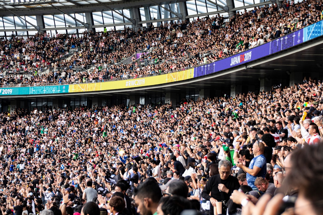 Diverse fans in the stands at The Oval experiencing the cricket economy of a live England Test match in south London